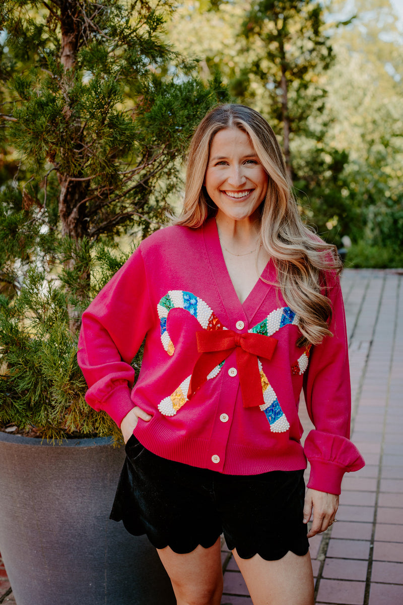 queen of sparkles: pink cardigan with candy cane and bow